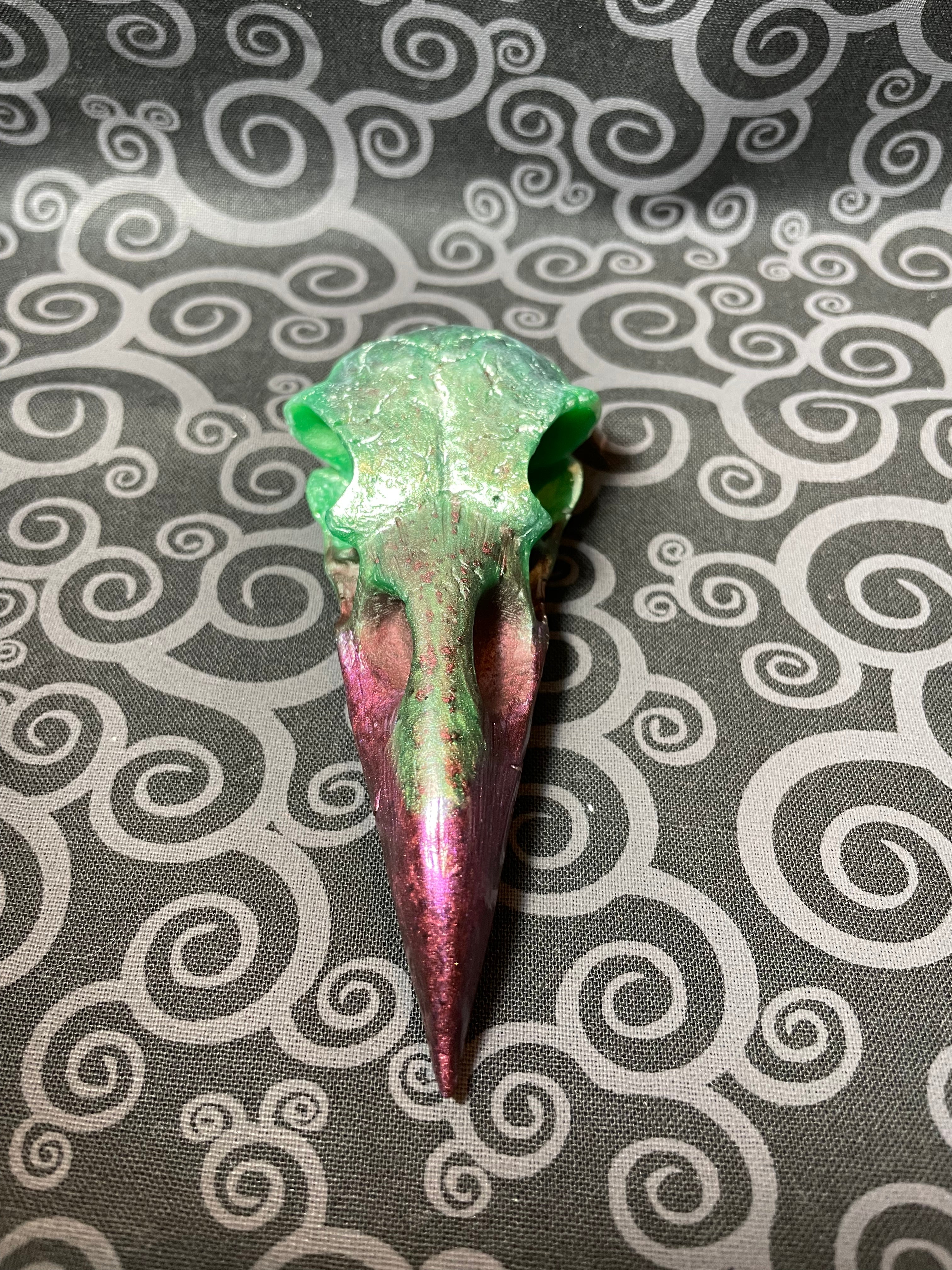 Green and purple crow skull